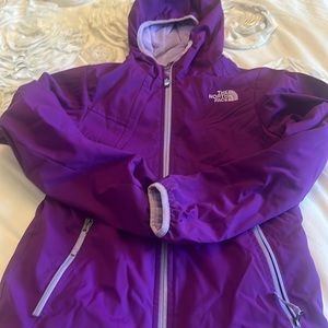 Purple The North Face girl’s raincoat with fleece lining
